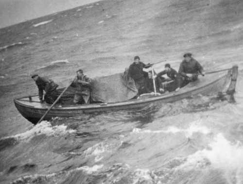 Rowboat in heavy seas 