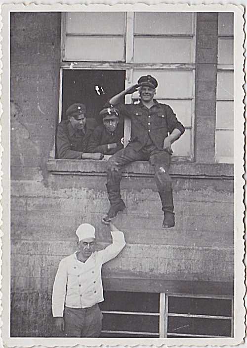 German soldiers posing/  window