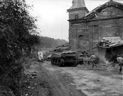 Sherman tank in a village