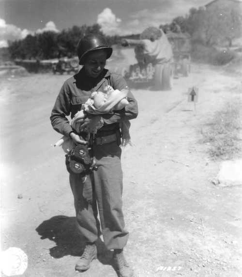 Soldier Holds Orphan