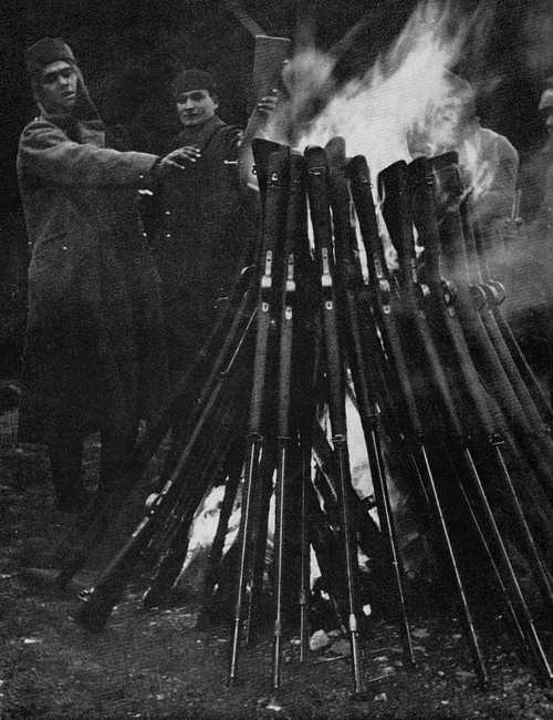 French soldiers burn their weapons