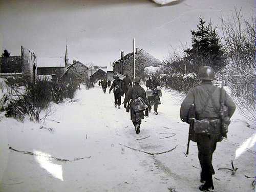 A marching into a Belgian village 
