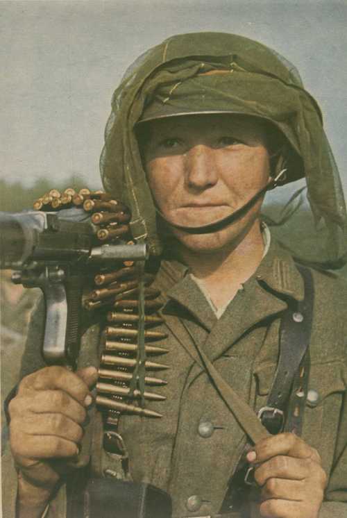 German MG gunner with mosquito net