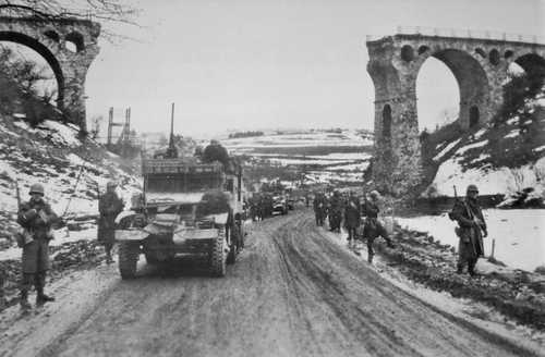 26th Infantry passing under viaduct