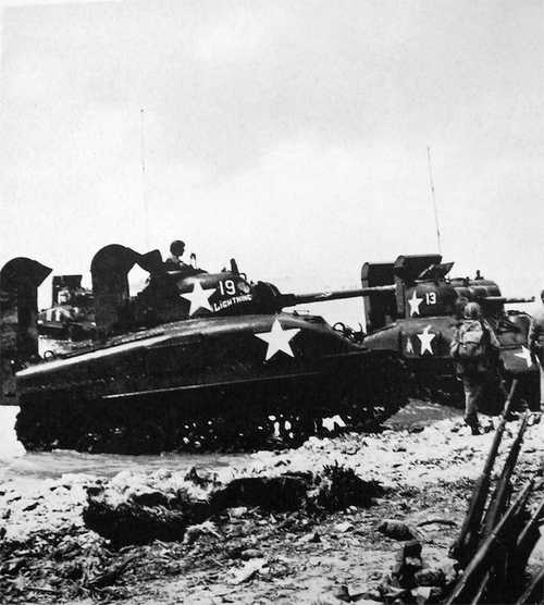 Sherman tanks hitting the beach