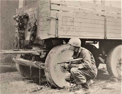A US soldier with a "Grease gun"