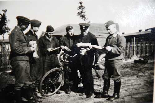 German soliders receiving mail in the field . 