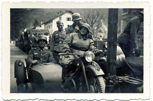 Motorcycle and parked column of vehicles