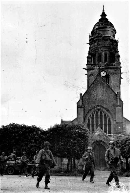 Passing in front of the church