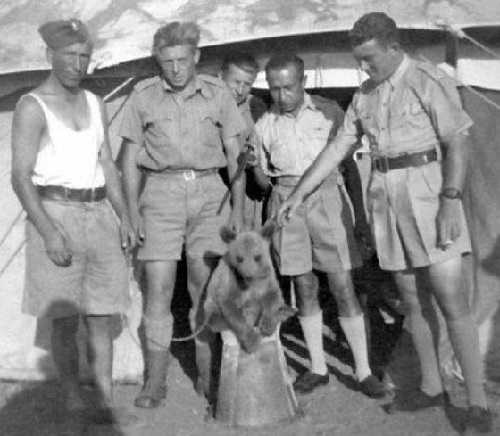 Baby Wojtek and comrades, Iran, 1942.