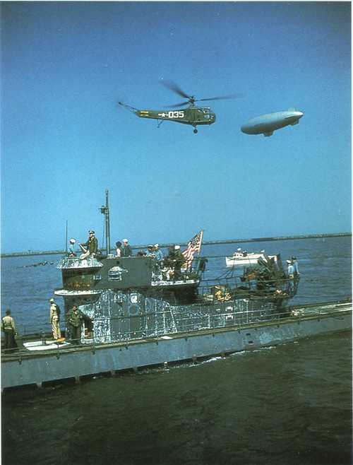 Helicopter and an airship escort