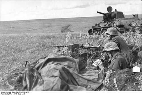 Lunch break in front of knocked out T-34
