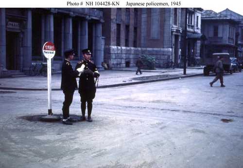 Japanese policeman at sign