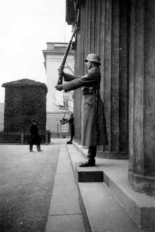 Guards salute a civilian