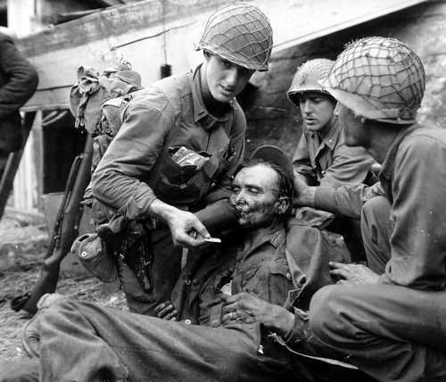 Soldiers Aiding German Soldier Man