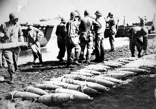 Unloading 155mm ammo