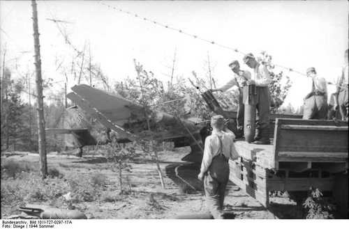 Maintenance men supply Ju-87 with bombs in Immola
