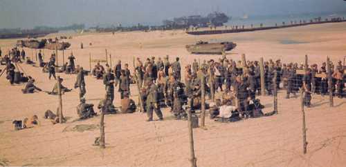 POW's on a Normandy beach.
