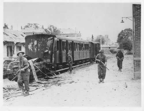 Canadians clear snipers from the railway station a