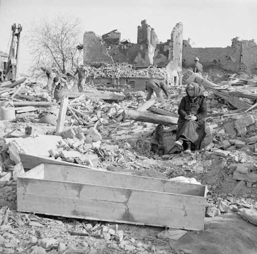 With a coffin in the ruins