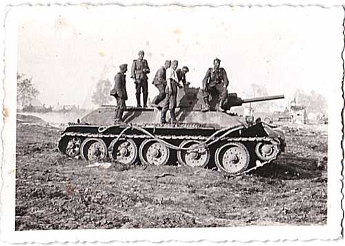 German soldiers atop of knocked out russian tank