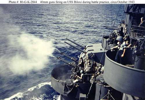 40mm guns firing on USS Biloxi during battle practice
