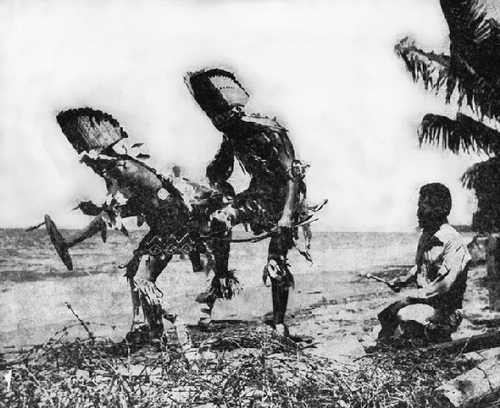 Navajos dance on a beach 