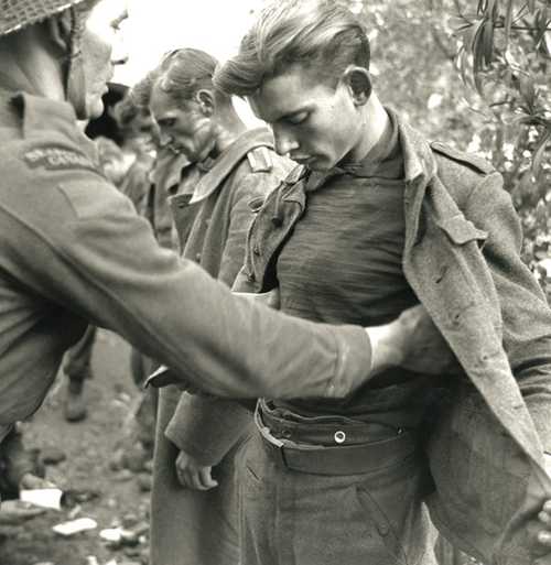 GERMAN PRISONER SEARCHED