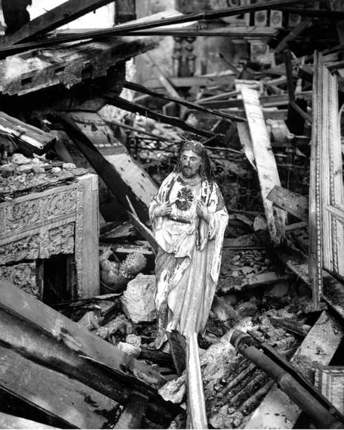 Jesus Statue in Rubble