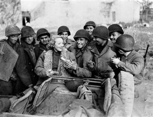 Signing autographs  for the troops
