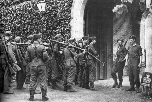 Germans surrendering their weapons to Canadians