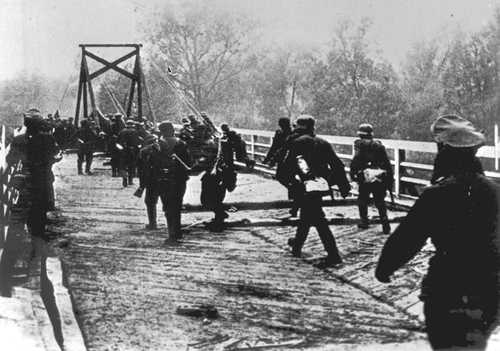 Germans cross a bridge