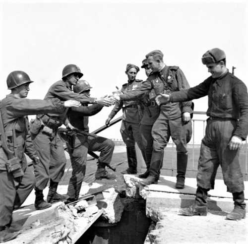 American GIs and Russian soldiers greet each other