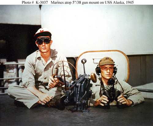 Marines atop 5&quot;/38 gun mount on USS Alaska