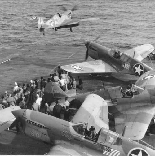 USS Chenango launching P-40's