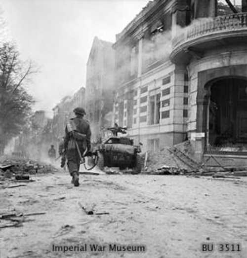 Troops and scout car in Arnhem 1945