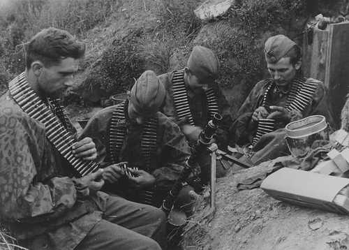 Loading belts by hand