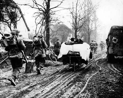 Infantry advancing, civilians fleeing