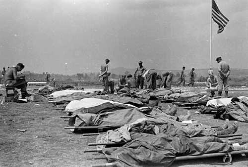 Corpsmen oversee the dead on Okinawa