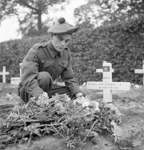A Canadian Soldier visits his brothers grave