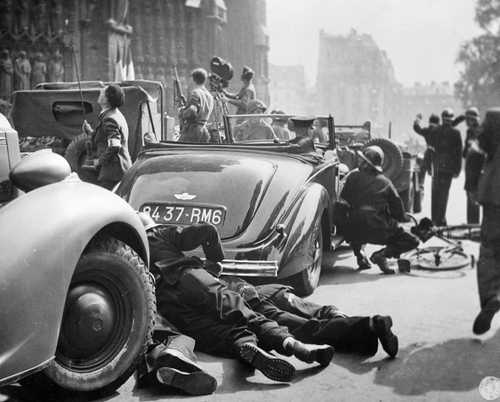Taking cover, Paris, 1944.
