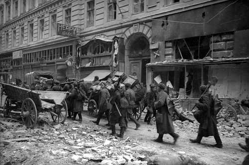 Moving along a war ravaged street