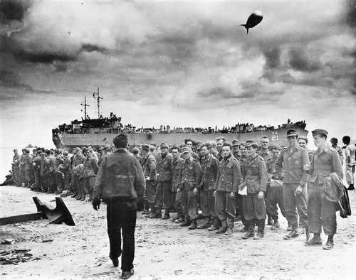 A group of German POWs waiting to move on