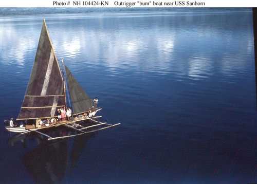 Outrigger &quot;bum&quot; boat near USS Sanborn