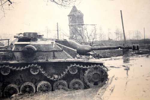 Destroyed tank in the mud. 