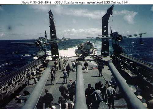 OS2U floatplanes warm up on board USS Quincy
