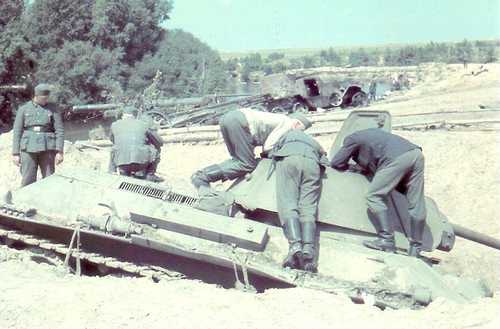 german engineers examinating one T34/76 .