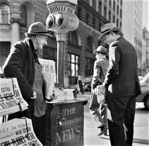 Newspaper vendor with "EXTRA" edition
