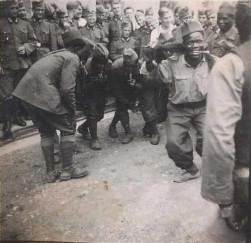 A Group of Black, Possibly  French POWs Performs for the Heer
