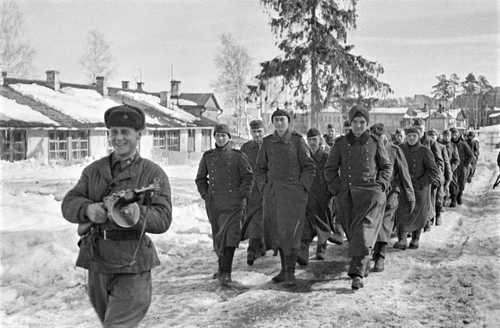 Smiling for the camera - he has the gun